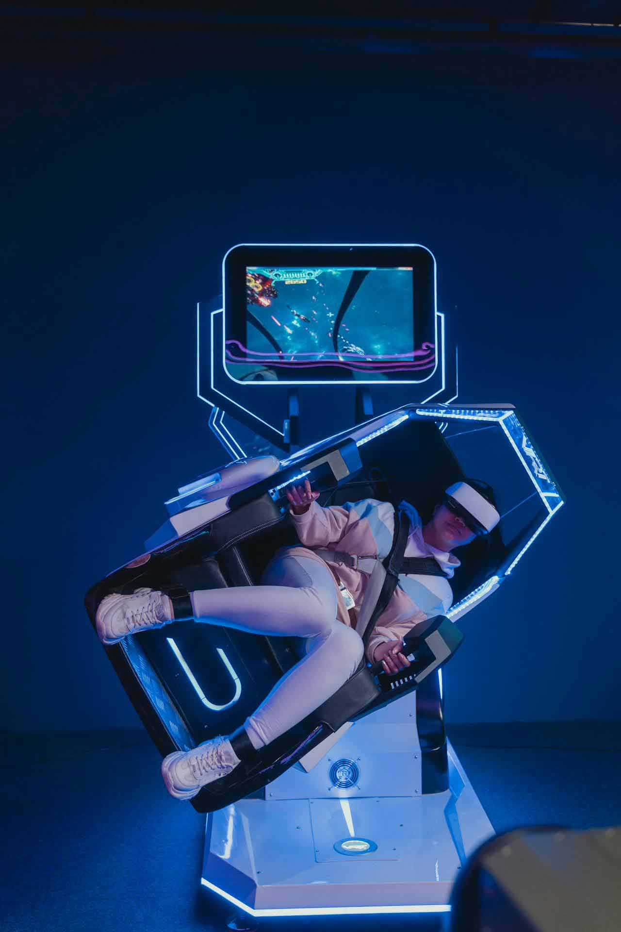 Gamer using a simulator machine